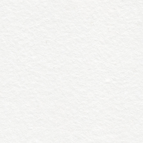 A closeup of white deckle edge hand made paper embedded with iridescent glitter