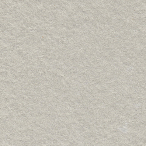 A closeup of warm grey deckle edge hand made paper