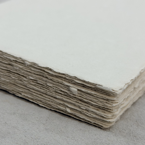 Stack of light taupe paper sheets 